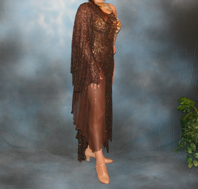 right side view on a taller model of Crystal's Creations Gold tango dress or Latin/rhythm dress created in chocolate brown stretch lace that is lavishly embellished with gold & a touch of emerald green Swarovski rhinestones overlayed & draped over a golden hologram tiger print bodysuit size 3/4-9/10