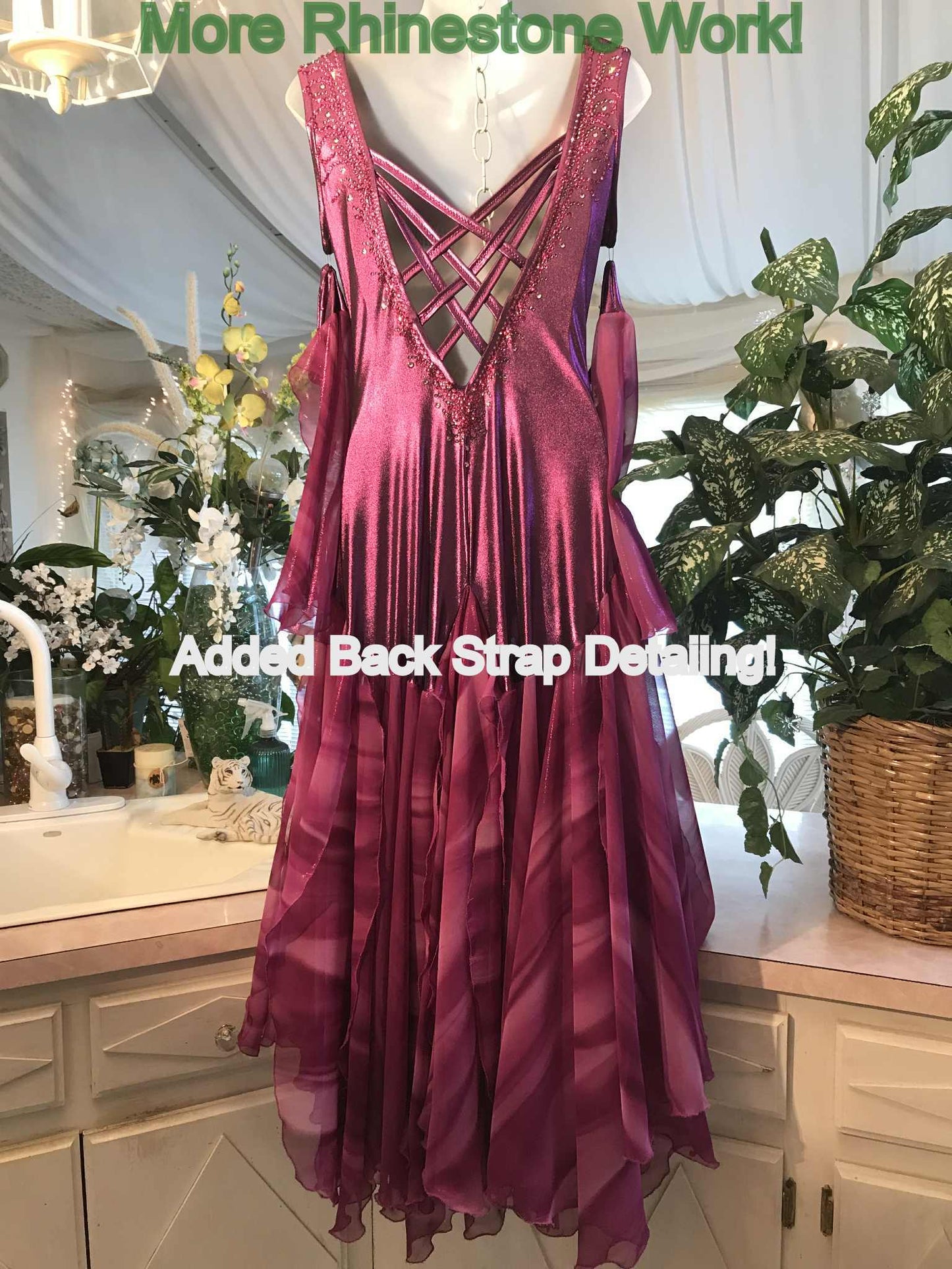 Crystal's Creations Purple/plum ballroom dress created of rich & Back view of luxurious plum metallic slinky ballroom dance dress with yards & yards of print chiffon… embellished with fuchsia Swarovski rhinestones… along with hand beading of bicone & teardrop Swarovski beads with added rhinestone work & back strap details