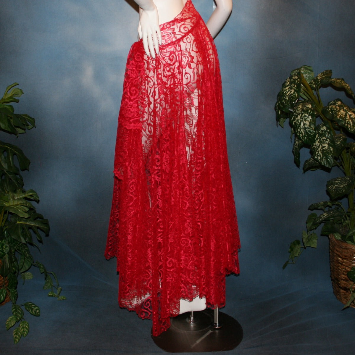 Crystal's Creations side view of Red lace ballroom skirt, wrap style, was created with yards of red lace, many panels shaped like large petals.