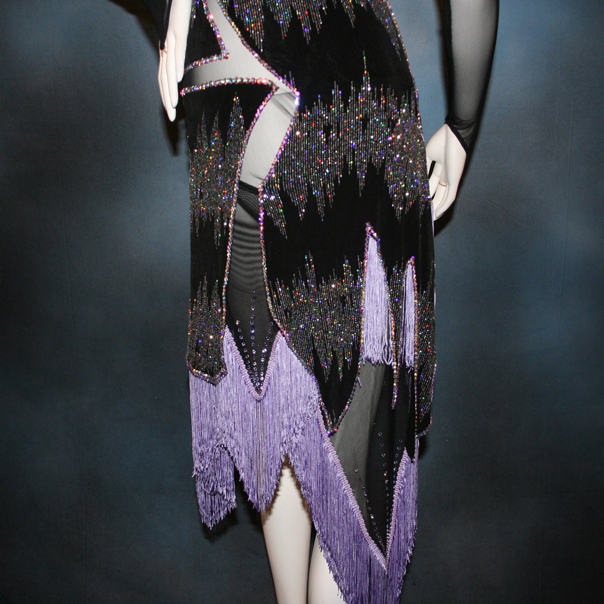 Crystal's Creattions back close up view of Latin/rhythm/converta ballroom dress created in black glitter slinky with an awesome electrifying Crystal AB glitter pattern artistically placed on a black stretch mesh base, embellished with Swarovski Crystal AB rhinestone work. It includes 3 skirts so you have 4 different looks for versatility.