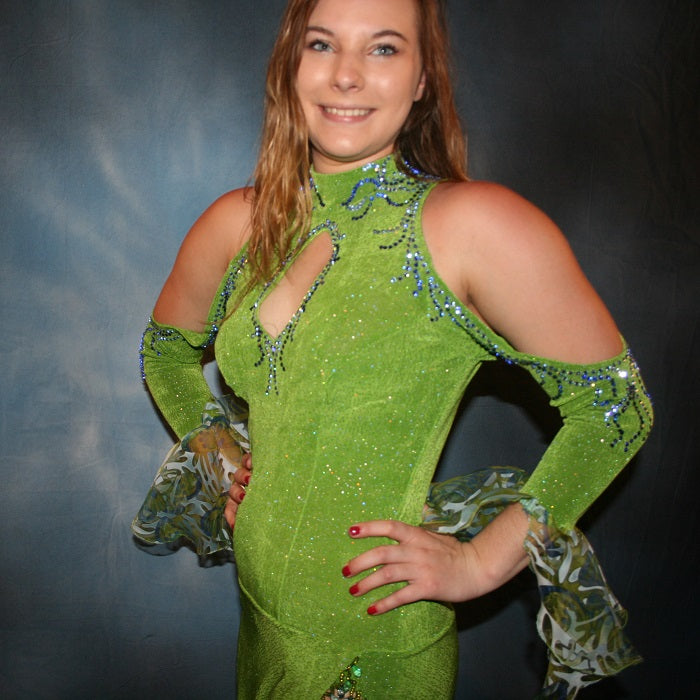 Crystal's Creations close up view of Green Latin/rhythm dance dress was created in apple green glitterknit slinky & printed chiffon flounces, embellished with sapphire & light sapphire Swarovski rhinestones, with hand beading.
