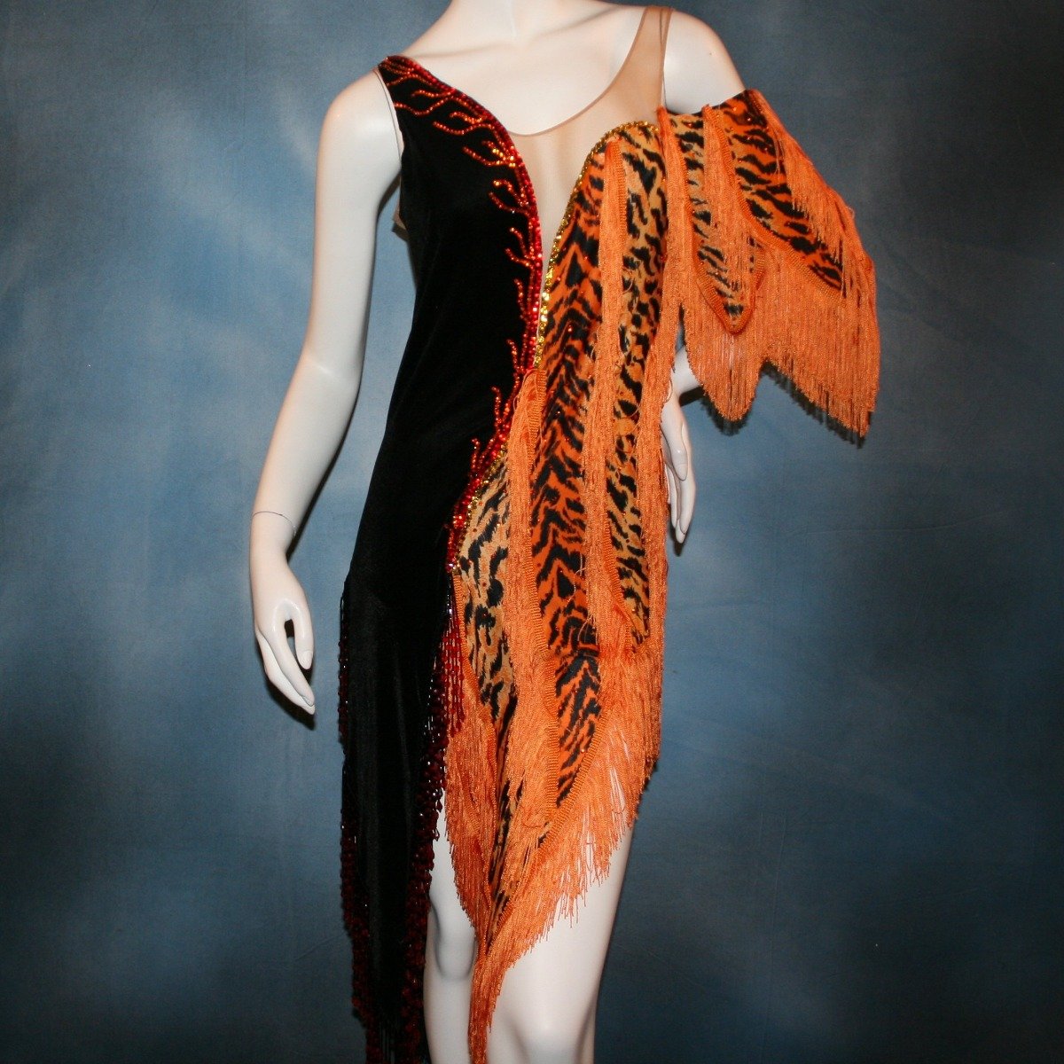 Crystal's Creations close up view of orange & black tiger print Latin/rhythm dress with fringe