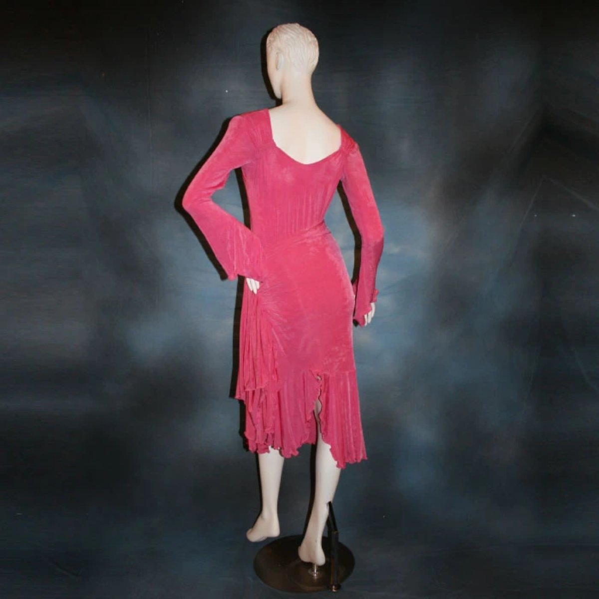 Crystal's Creations backview of Bubble gum pink solid slinky body suit with long flaired sleeves includes 3 ballroom skirts, one for smooth with yards of glitter chiffon, a 2nd, with oodles of print chiffon flounces, which is great for rumba, bolero or tango & a 3rd of solid slinky to wear for Latin/rhythm dancing