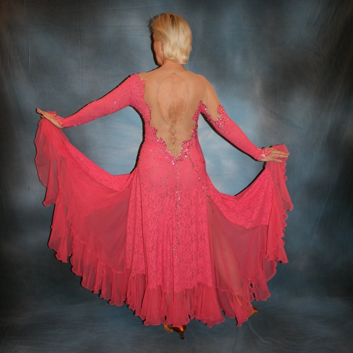 Crystal's Creations back view of Gorgeous salmon pink ballroom dance dress was created from salmon pink stretch lace on nude illusion base with yards & yards of salmon pink chiffon insets & flounces …