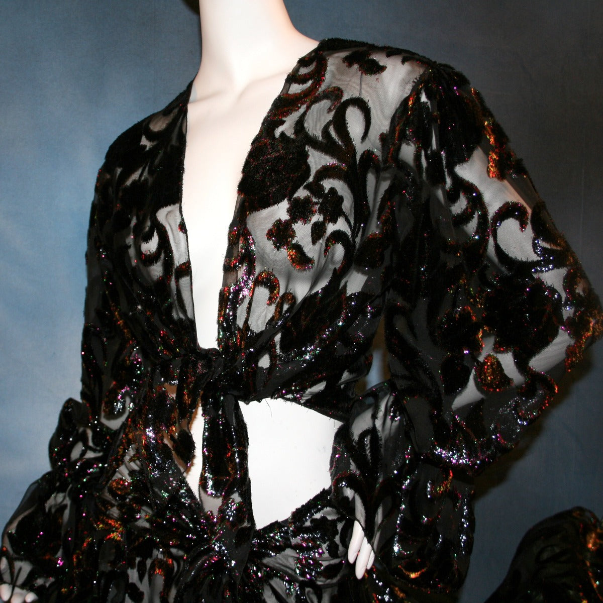 top view of Black wrap style panel ballroom skirt was created of black, fuchsia, & emerald green metallic burnout velvet with matching long full sleeve midriff top. This gorgeous ballroom dance set is very sheer, so, wear dance pants & bra or tube top....or...a custom created midriff top to wear underneath the top would look fabulous...in either the fuchsia or emerald green to make it really POP on the ballroom dance floor!