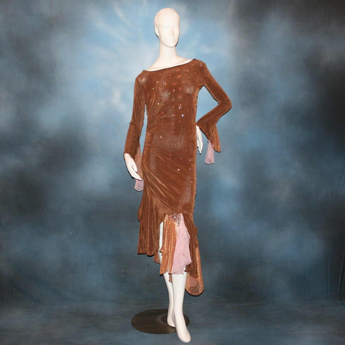 Latin/rhythm dress created of luxurious solid slinky in cinnamon brown with accents of bronze & soft pink is lavishly embellished with Swarovski