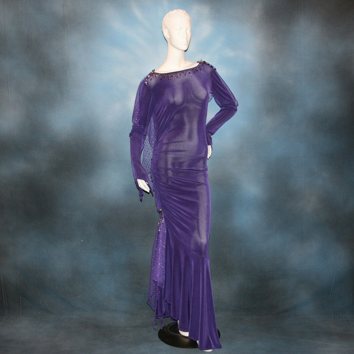 Crystal's Creations Purple Latin/rhythm/tango dress created of deep grape purple solid slinky with a touch of Swarovski rhinestone work done in metallic light gold & deep velvet purple, along with some hand beading & some gorgeous glittery floats.