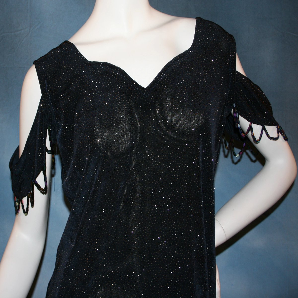 Crystal's Creations close up view of Navy Latin/rhythm/social dance dress created in navy glitter slinky fabric with oodles of glitter organza flounces of navy & soft yellow, with hand beading at sleeve edges & back peek-a-boo. A great social ballroom dress for any special occasion, as well as a Latin/rhythm dance dress!