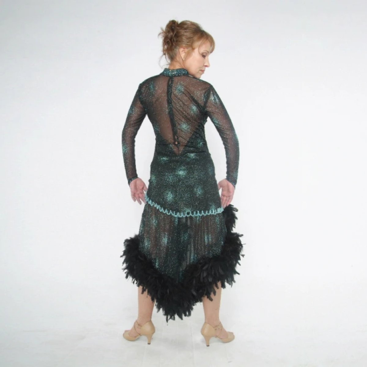back view of Elegant black Latin/rhythm dance dress was created in a black glitter sheer mesh with aqua glitter bursts over black lycra body suit, embellished with jet AB Swarovski stones, hand beading, plus chandelle feathers.