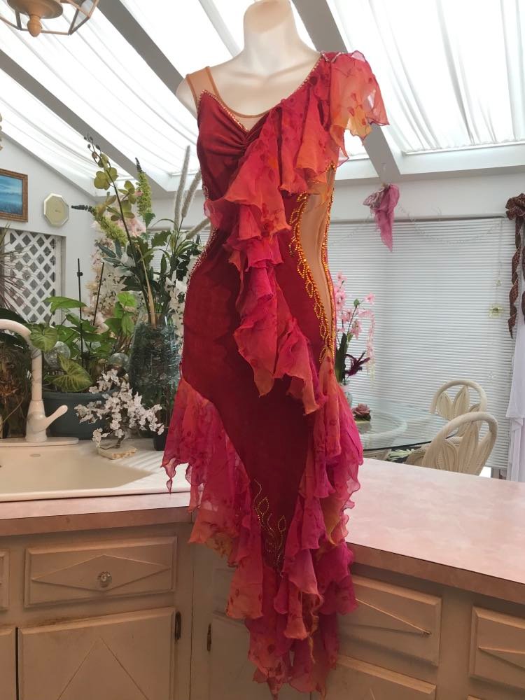 Latin/rhythm dress portion of Gorgeous rose colored converta ballroom dance dress was created on a nude illusion base of rose colored slinky with flounces of a gorgeous oriental flower print crinkle chiffon of pinks, yellows & oranges. Detailed Swarovski rhinestone work which ties in so beautifully with with the print chiffon, is done in pinks, yellows & orange.