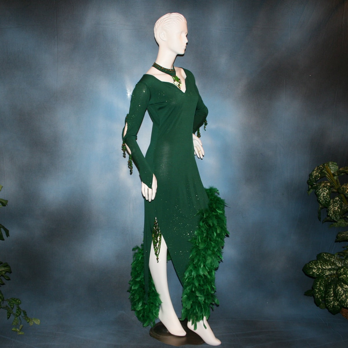 Crystal's Creations side view of Green Latin/rhythm dress was created in luxurious deep emerald glitter slinky, embellished with chandelle feathers & Swarovski hand beaded detailing.