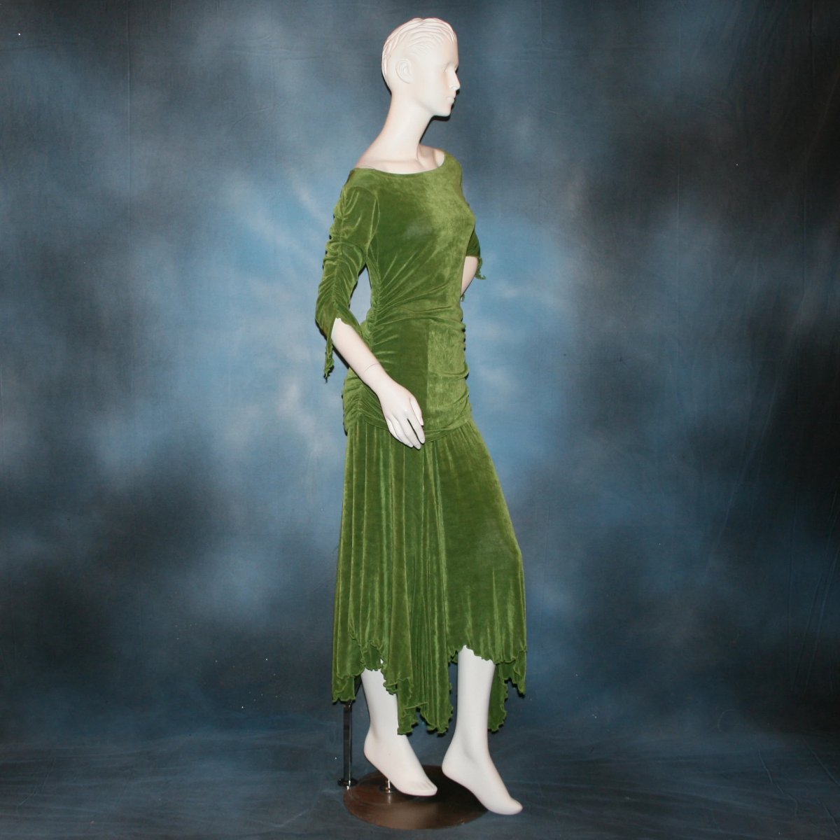 right side view of Ruched top with ruched 3/4 sleeves with a slight flaired detail includes trumpet flaired ballroom dance skirt with peaks created of luxurious olive green solid slinky fabric, & can be custom created in many colors. Great for ballroom dance teachers!