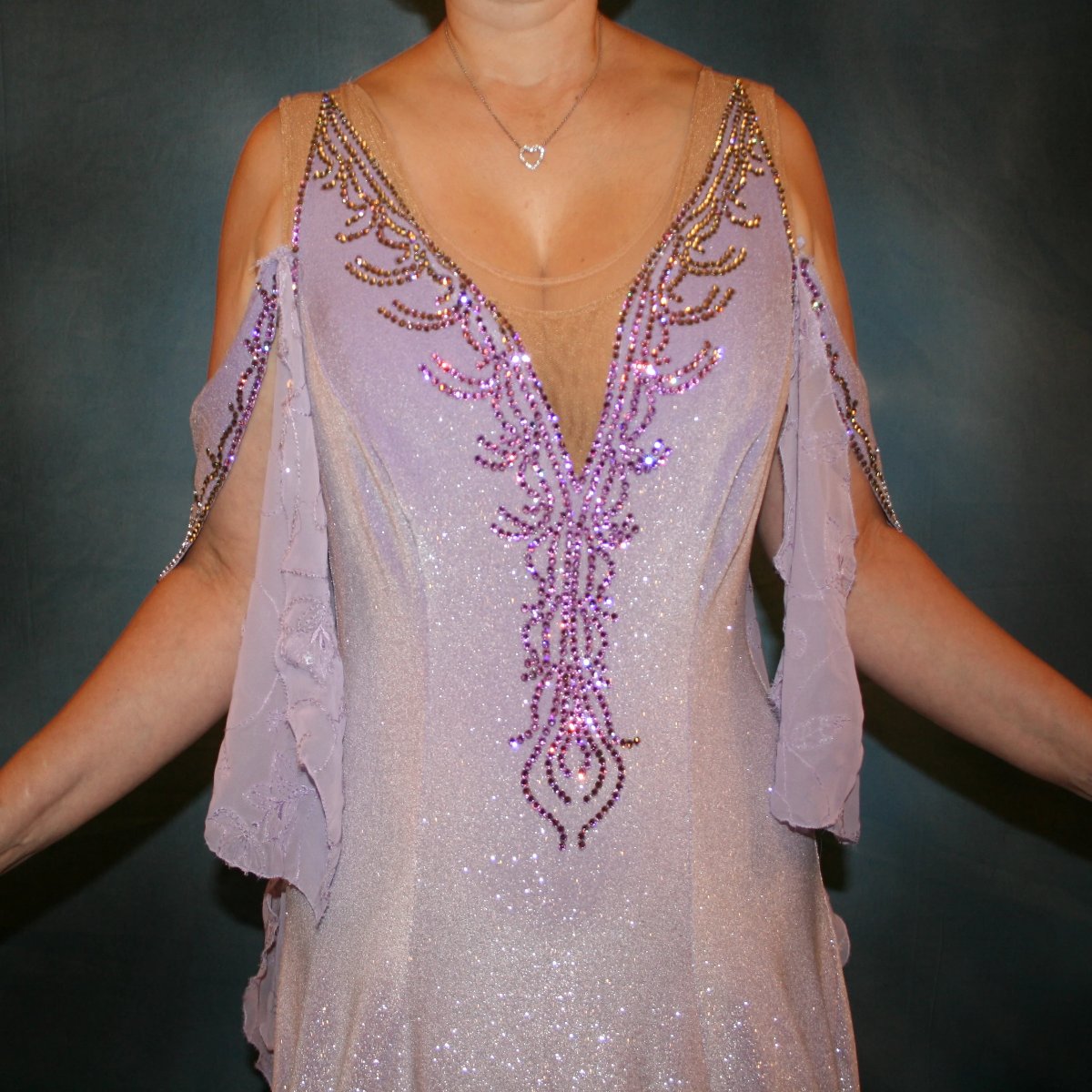 Crystal's Creations close up view of Orchid ballroom dress created from luxurious glitter stretch velvet on nude illusion base with embroidered sequined chiffon insets & floats, embellished with crystal vitrail light Swarovski rhinestone work