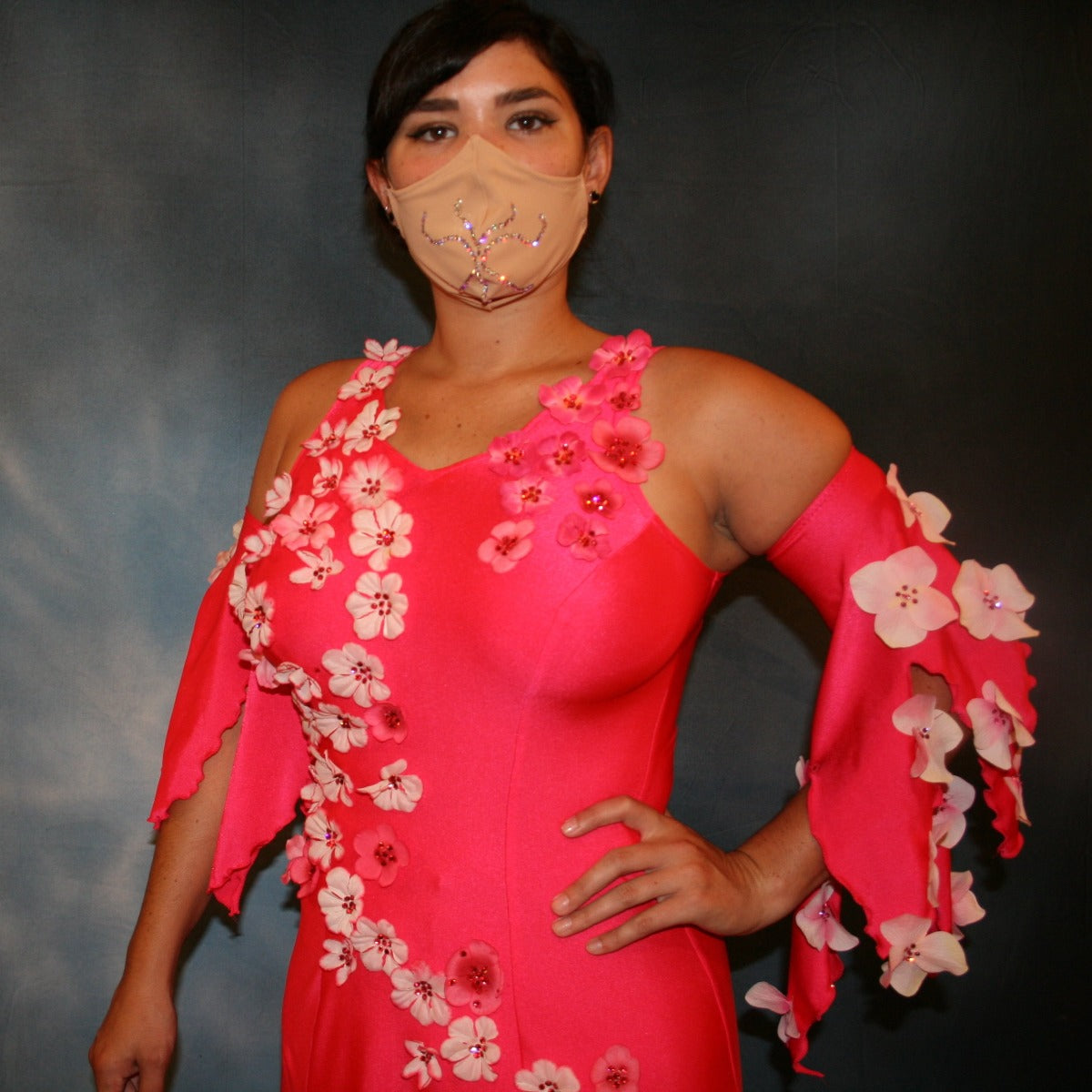 Crystal's Creations close up of Crystal's Creations Deep pink ballroom dress created of Indian pink lycra base with yards & yards of Indian pink print chiffon large & flowing flounces, embellishing done with silk flowers, accented with Swarovski stonework in Indian pink
