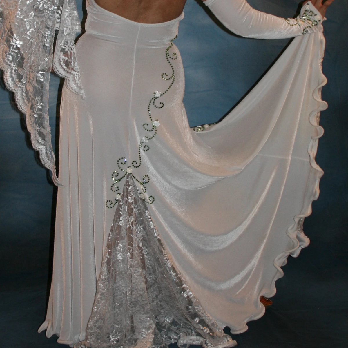 Crystal's Creations back closeup view of White ballroom dance dress was created in luxurious white stretch velvet with sequined lace insets & arm float, embellished with green peridot Swarovski detailed rhinestone work & miniature silk roses
