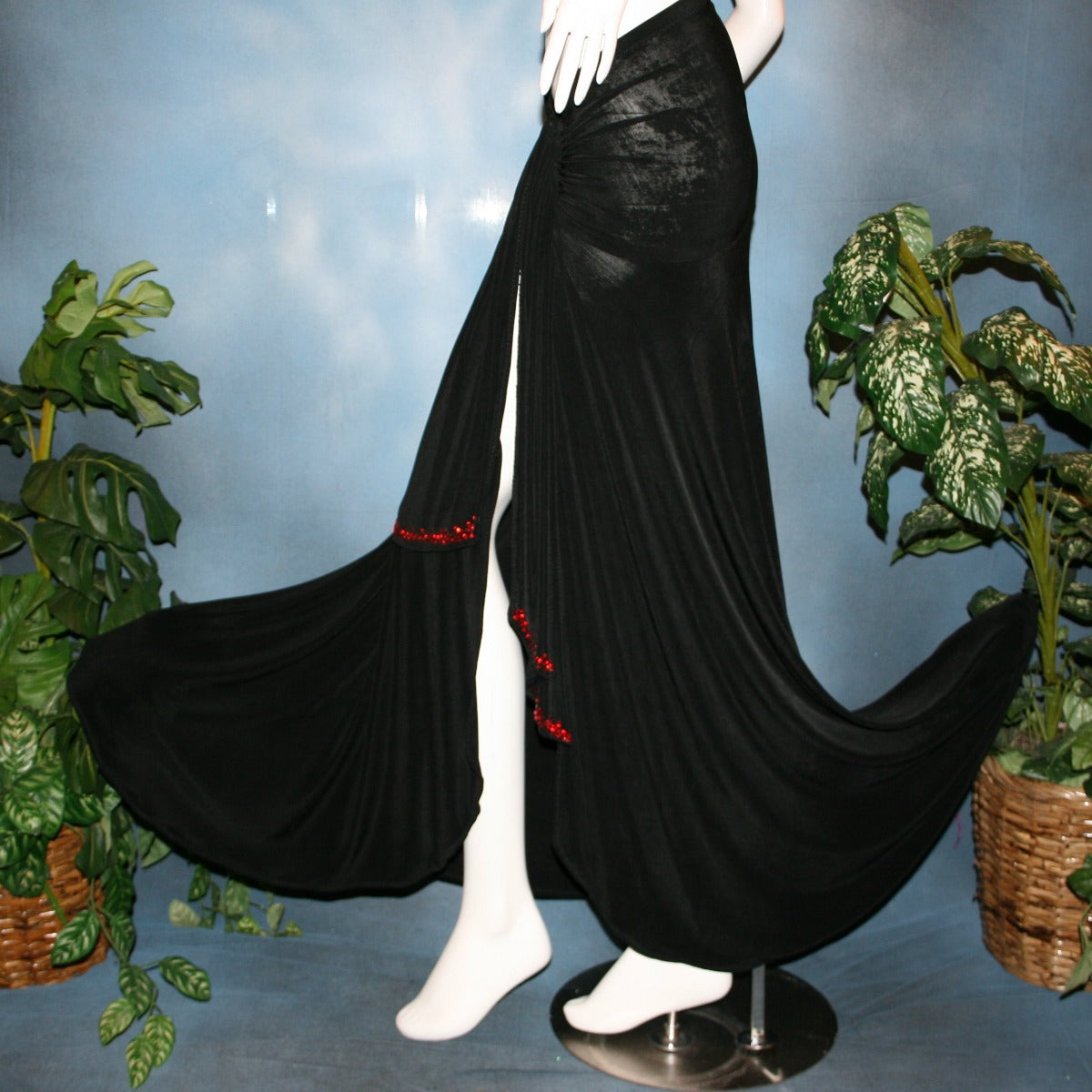 left side view of Black Sarong wrap style ballroom skirt created in luxurious black solid slinky with light siam Swarovski rhinestone work on sash edges.