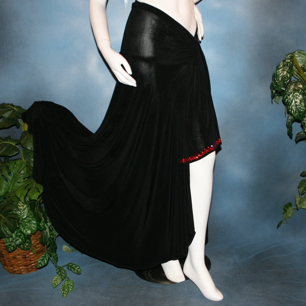 right side view of Black Sarong wrap style ballroom skirt created in luxurious black solid slinky with light siam Swarovski rhinestone work on sash edges.