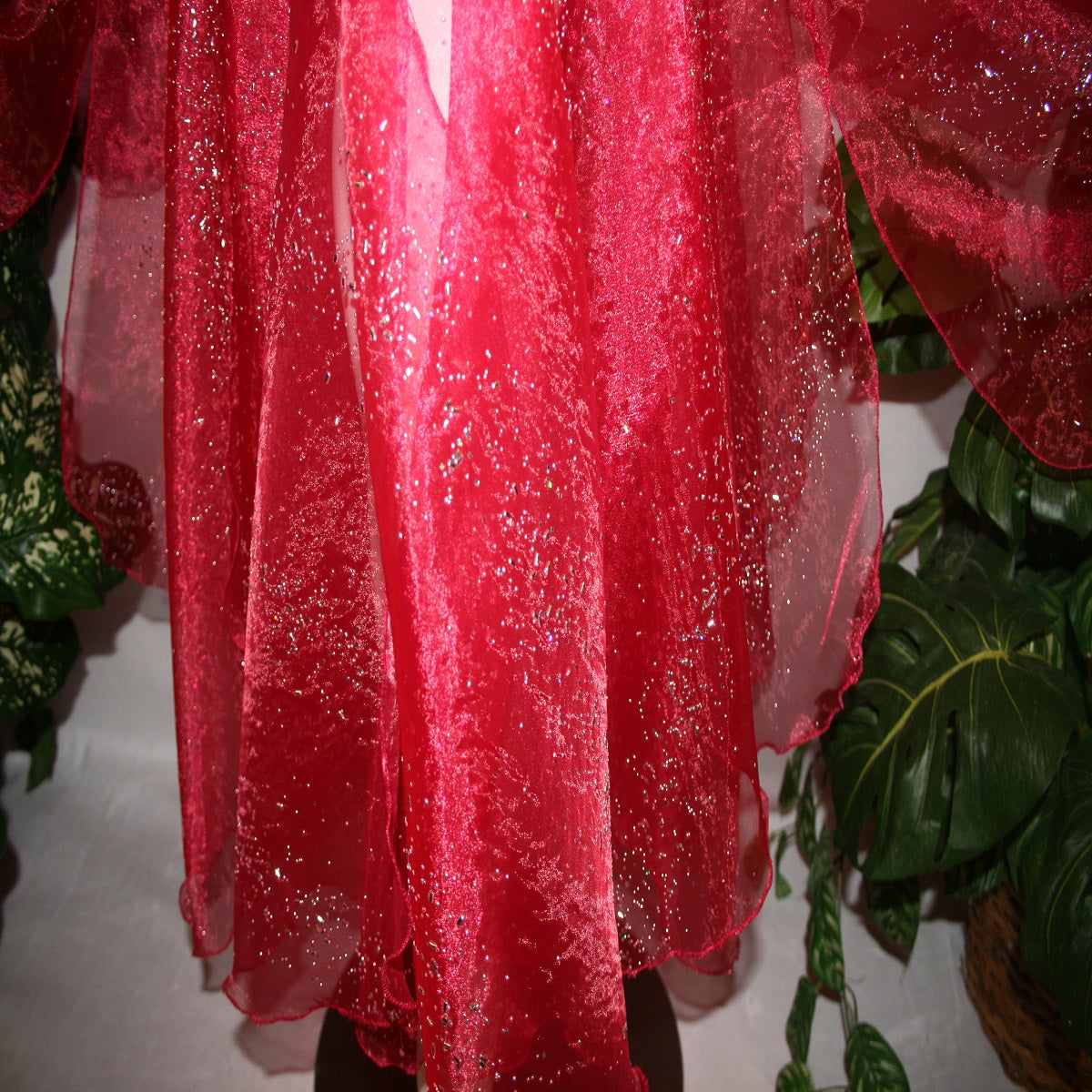 close up view of Red ballroom skirt created on a nude illusion hip band of yards of scarlette red panels with silver & pearlized flecking, very cool & showy!