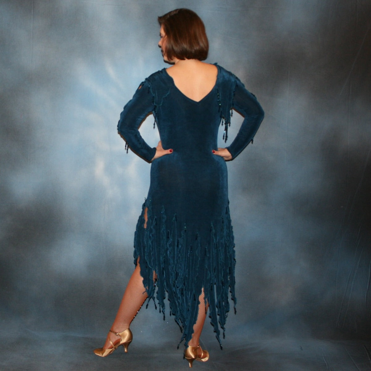 Crystal's Creations back view of Deep sea blue social Latin/rhythm dress created in luxurious solid deep blue slinky fabric, featuring exquisite petal detailing, with extensive deep blue metallic hand beading. A great social ballroom dance dress for any special occasion, as well as a great beginner Latin/rhythm show dance dress!