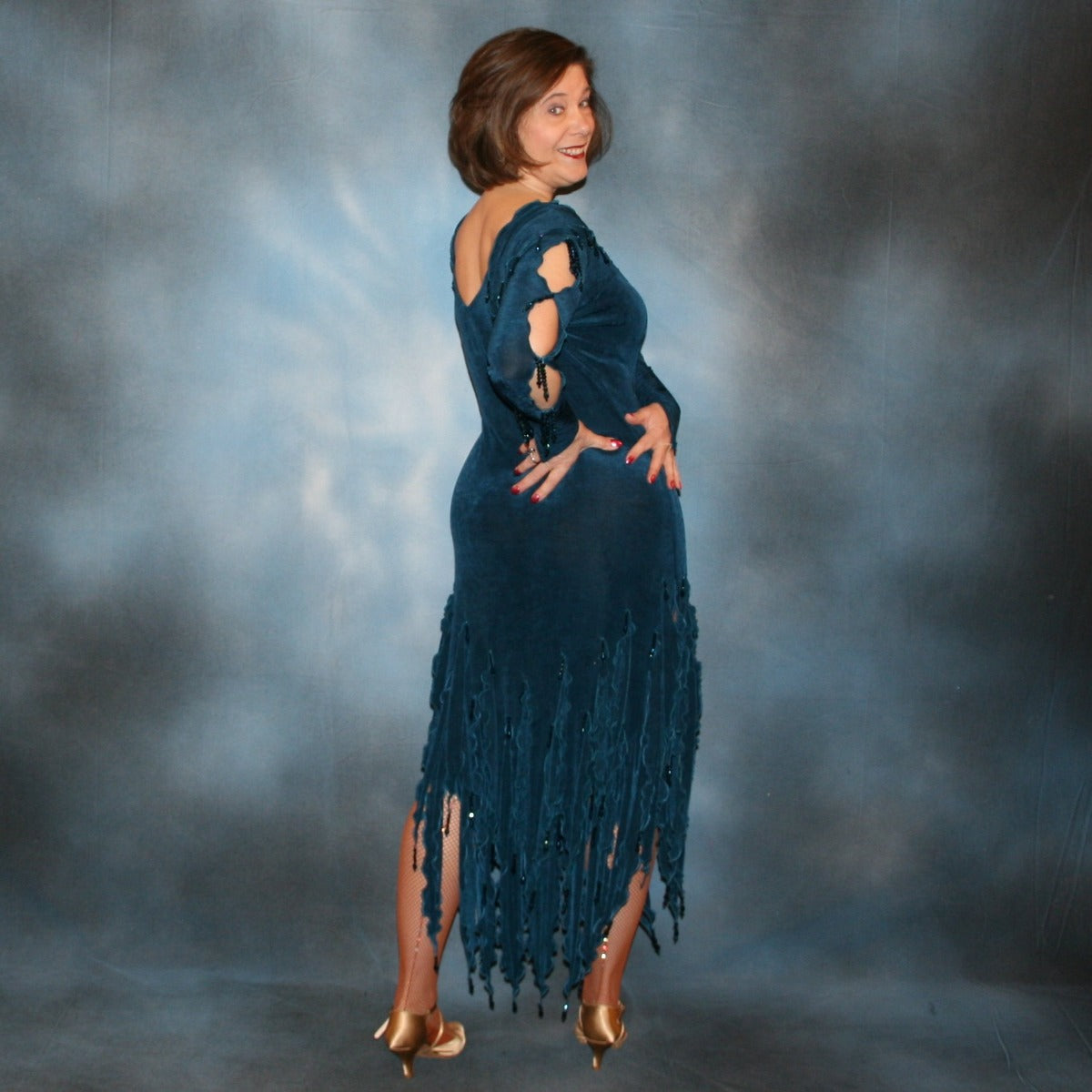 Crystal's Creations back side view of Deep sea blue social Latin/rhythm dress created in luxurious solid deep blue slinky fabric, featuring exquisite petal detailing, with extensive deep blue metallic hand beading. A great social ballroom dance dress for any special occasion, as well as a great beginner Latin/rhythm show dance dress!