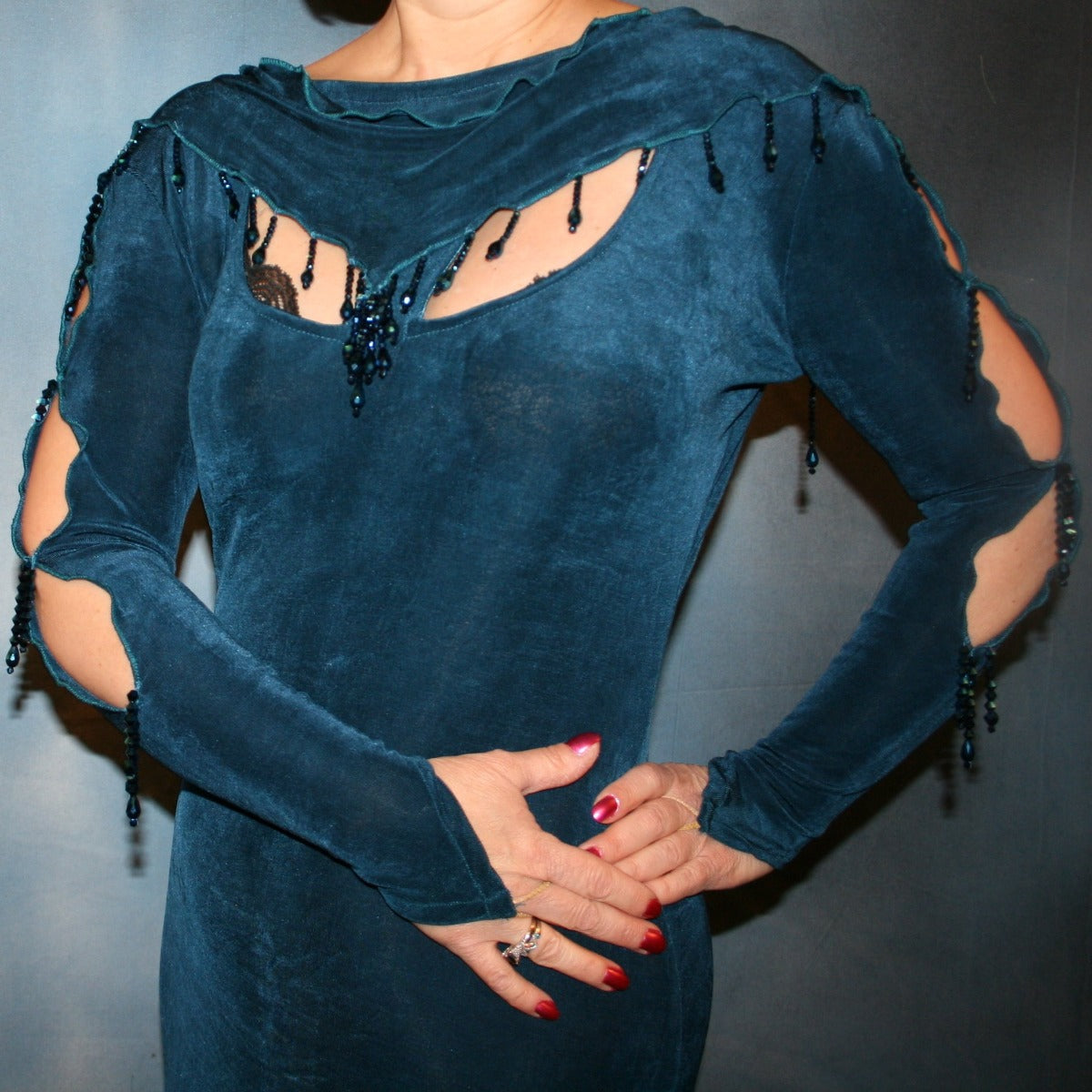 Crystal's Creations close up top view of Deep sea blue social Latin/rhythm dress created in luxurious solid deep blue slinky fabric, featuring exquisite petal detailing, with extensive deep blue metallic hand beading. A great social ballroom dance dress for any special occasion, as well as a great beginner Latin/rhythm show dance dress!