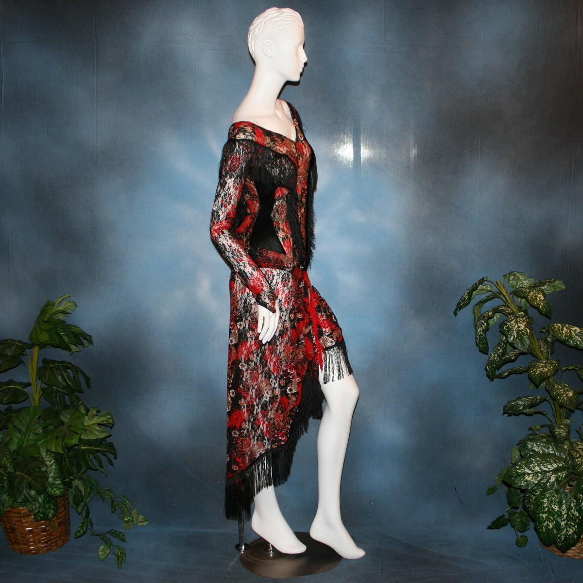 side view of Lace bodysuit & Latin/rhythm skirt created in red, black, and a touch of white stretch lace with chainette fringe trim. Fun dance set for any social ballroom dance, beginner ballroom showdance dress, or ballroom dance teachers!