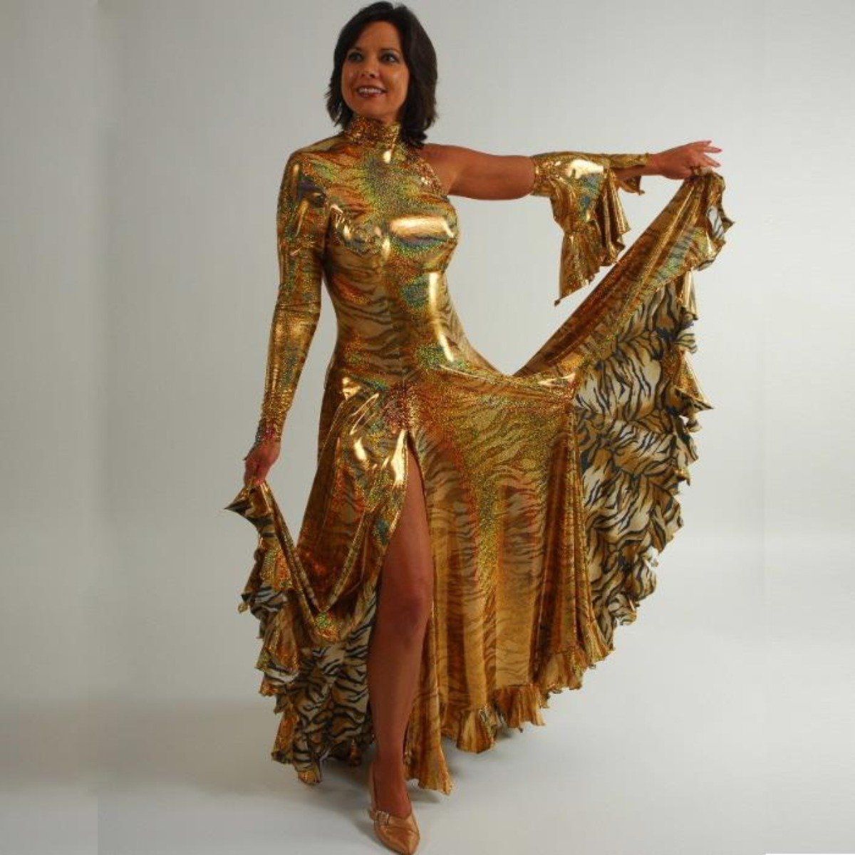 Crystal's Creations Gold tango/paso-doble dress created of gold iridescent hologram tiger print lycra features lots of flounces & is embellished with special volcano colored Swarovski rhinestone work size 5/6-9/10