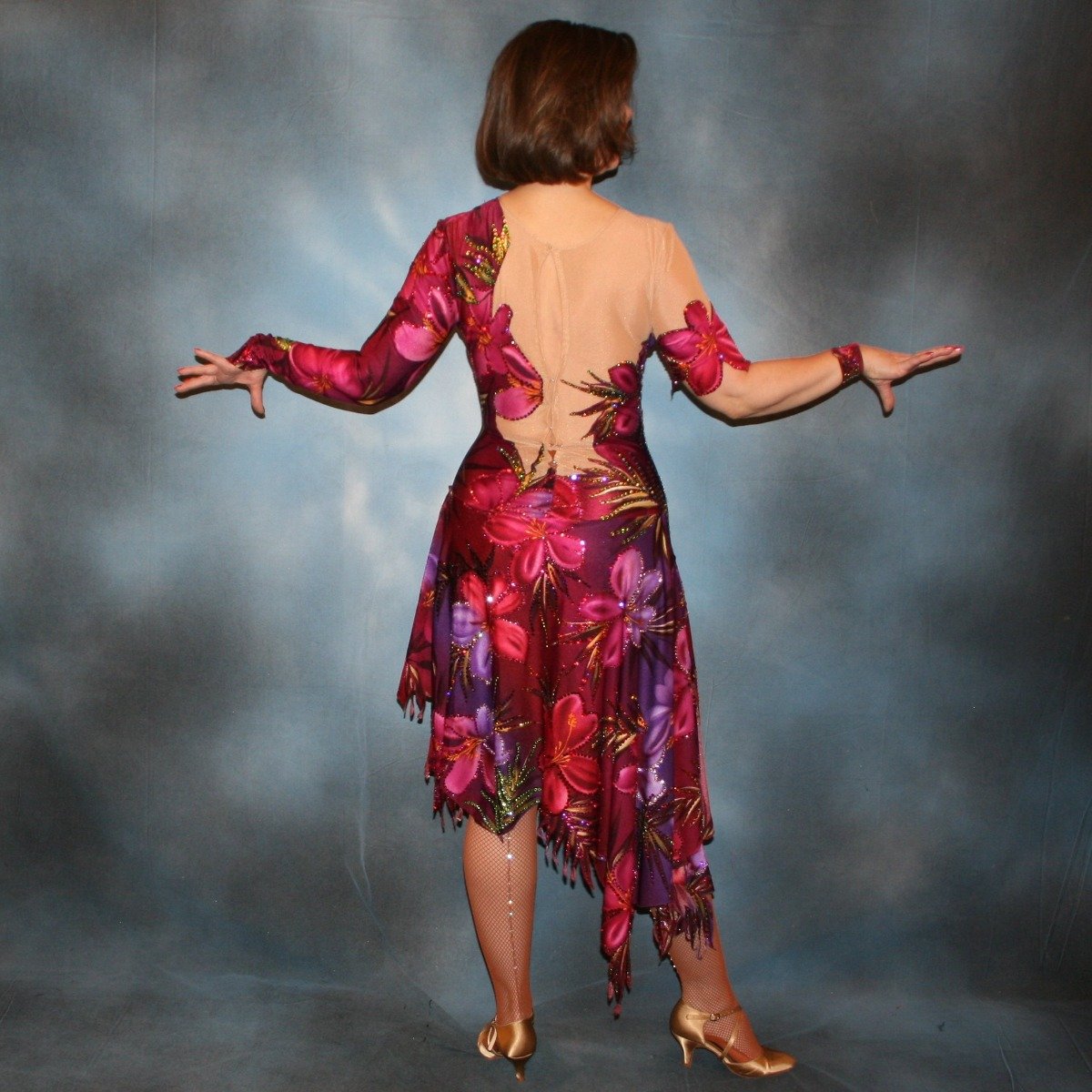 Crystal's Creations back view of Tropical print Latin/rhythm dress created in tropical print lycra in burgundies & purples on a nude illusion base, embellished lavishly with Swarovski rhinestone work in burgundies, purples, orchids & a touch of the greens & golds that are within the print.