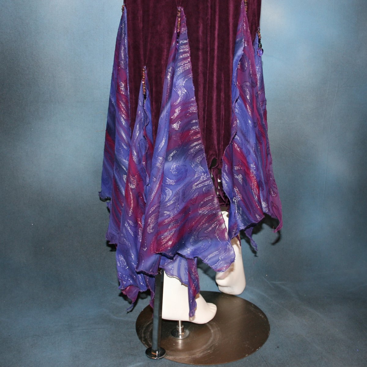 lower view of Social ballroom dance dress created in luxurious wine solid slinky fabric with flounces of deep scarlette & wine printed & dazzling chiffon, with Swarovski hand beading. A great social dress for any ballroom dance or special occasion, as well as a great beginner ballroom dance show dress!