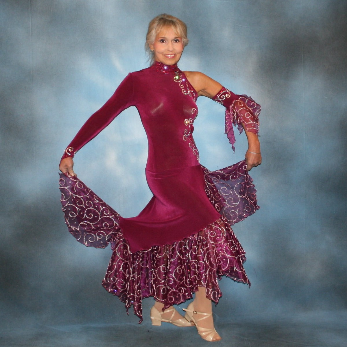 Crystal's Creations Magenta tango dress or Latin/rhythm dress done in luxurious magenta solid slinky with oodles of scrollwork embellished organza flounces with fuchsia & crystal Swarovski rhinestones.