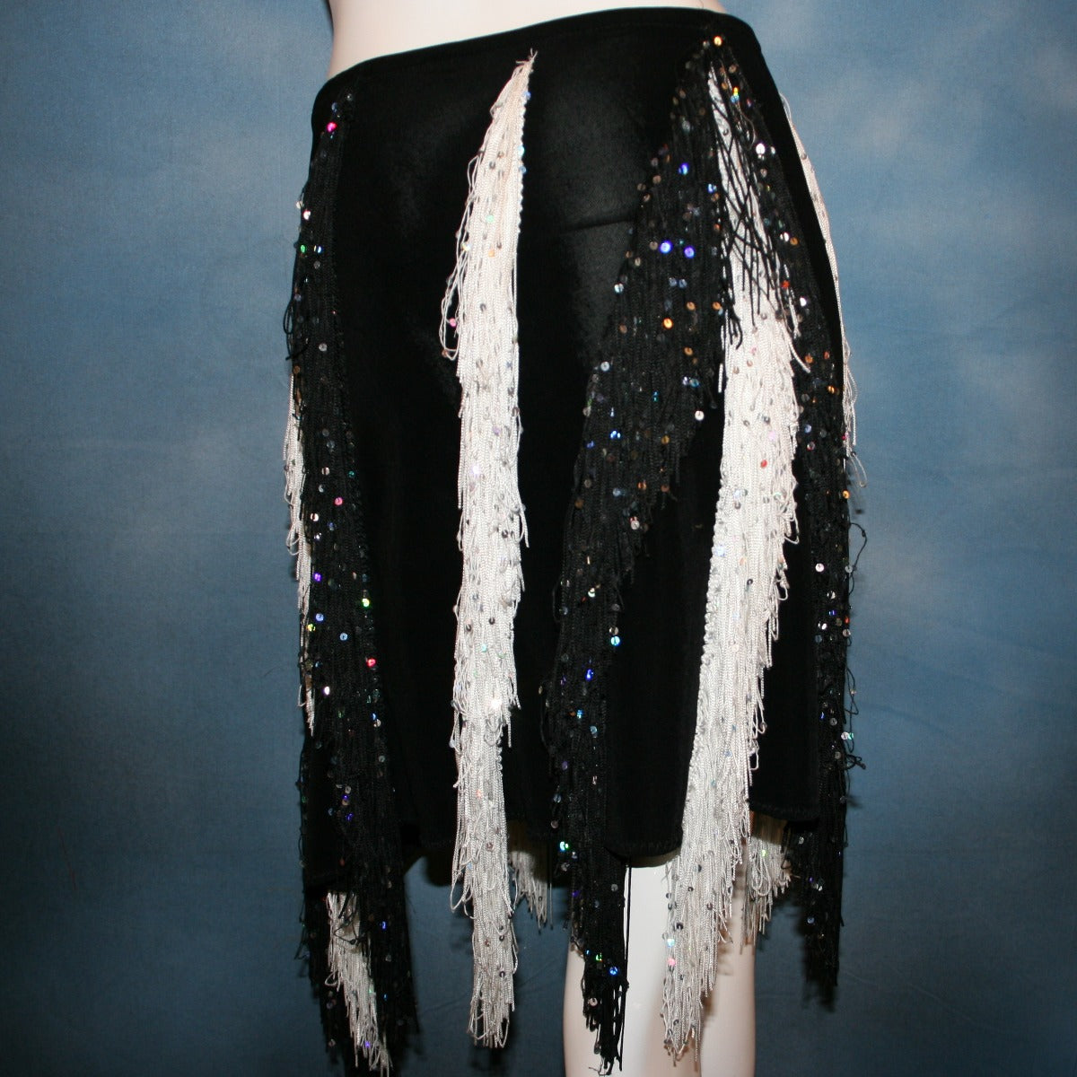 close view of Black & white Latin/rhythm skirt created of luxurious black solid slinky with vertical rows of black & white hologram sequined fringe, would pair greatly with a simple black bodysuit....or a custom created bodysuit or two would be fabulous for versatility, one on the simple classic side & one fabulously ornate with Swarovski rhinestone work!