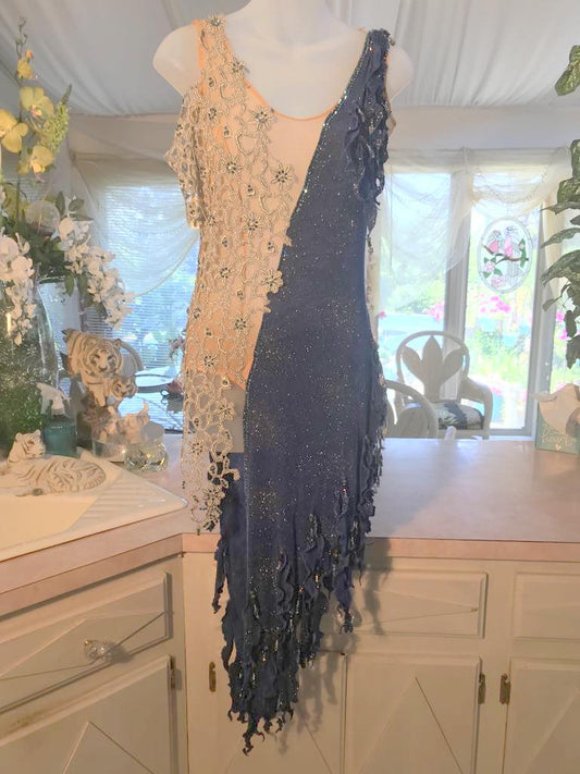 Crystal's Creations Deep blue & silver Latin/rhythm dress created in deep blue glitter slinky & textured silver lace on nude illusion base, with hand cut details, embellished with Swarovski rhinestone work & hand beading.