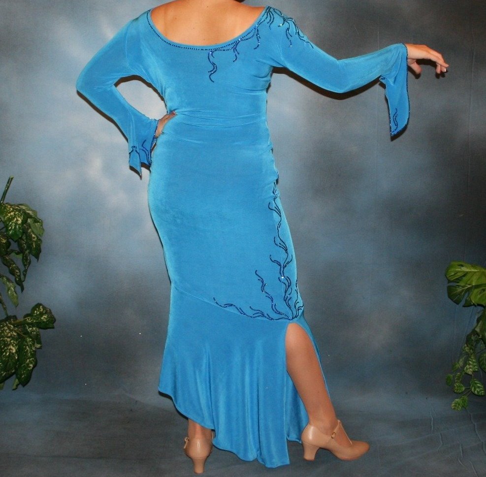 back view of Crystal's Creations blue Latin/rhythm dress created of luxurious blue slinky, embellished with Swarovski detailed rhinestone work