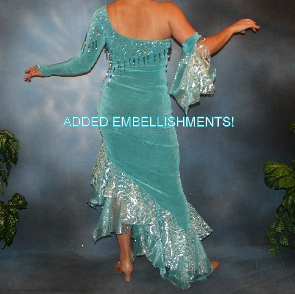 Back view of Crystal's Creations aqua Latin/rhythm dress created in aqua luxurious solid slinky with glitter organza flounces, aqua Swarovski rhinestone work, now with added hand beading, arm embellishment & more flounces