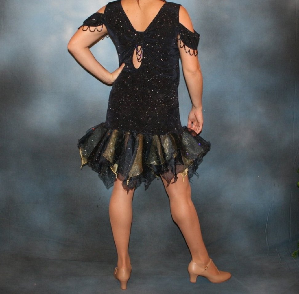 back view of Crystal's Creations Navy Latin/rhythm/social dance dress created in navy glitter slinky fabric with oodles of glitter organza flounces of navy & soft yellow, with hand beading at sleeve edges & back peek-a-boo. A great social ballroom dress for any special occasion, as well as a Latin/rhythm dance dress