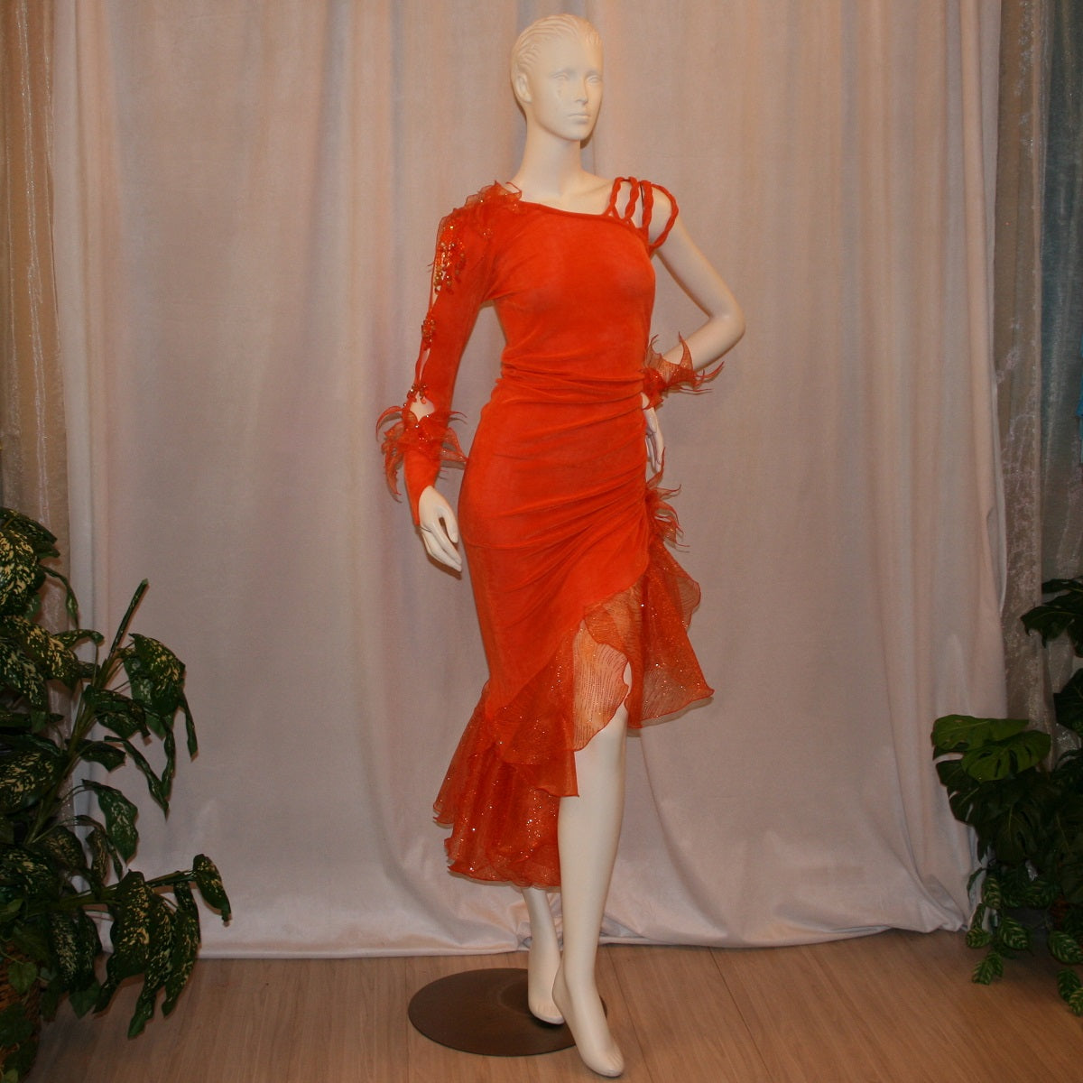 Crystal's Creations Orange Latin/rhythm dress was created in luxurious orange solid slinky with oodles of glitter organza flounces & accents, embellished with a touch of Swarovski hand beading.