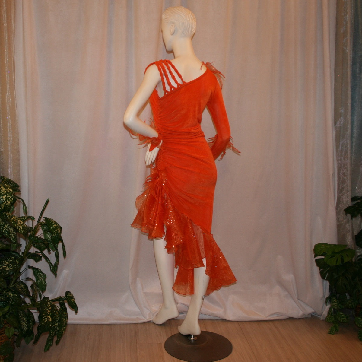 Crystal's Creations back view of Orange Latin/rhythm dress was created in luxurious orange solid slinky with oodles of glitter organza flounces & accents, embellished with a touch of Swarovski hand beading.