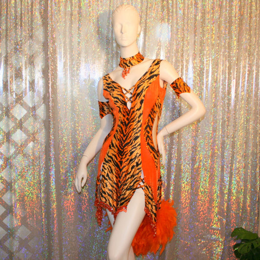 Close up view of added arm embellishments & neckpiece to  Crystal's Creations orange & black tiger print Latin/rhythm dress with chandelle feathers & hand beading