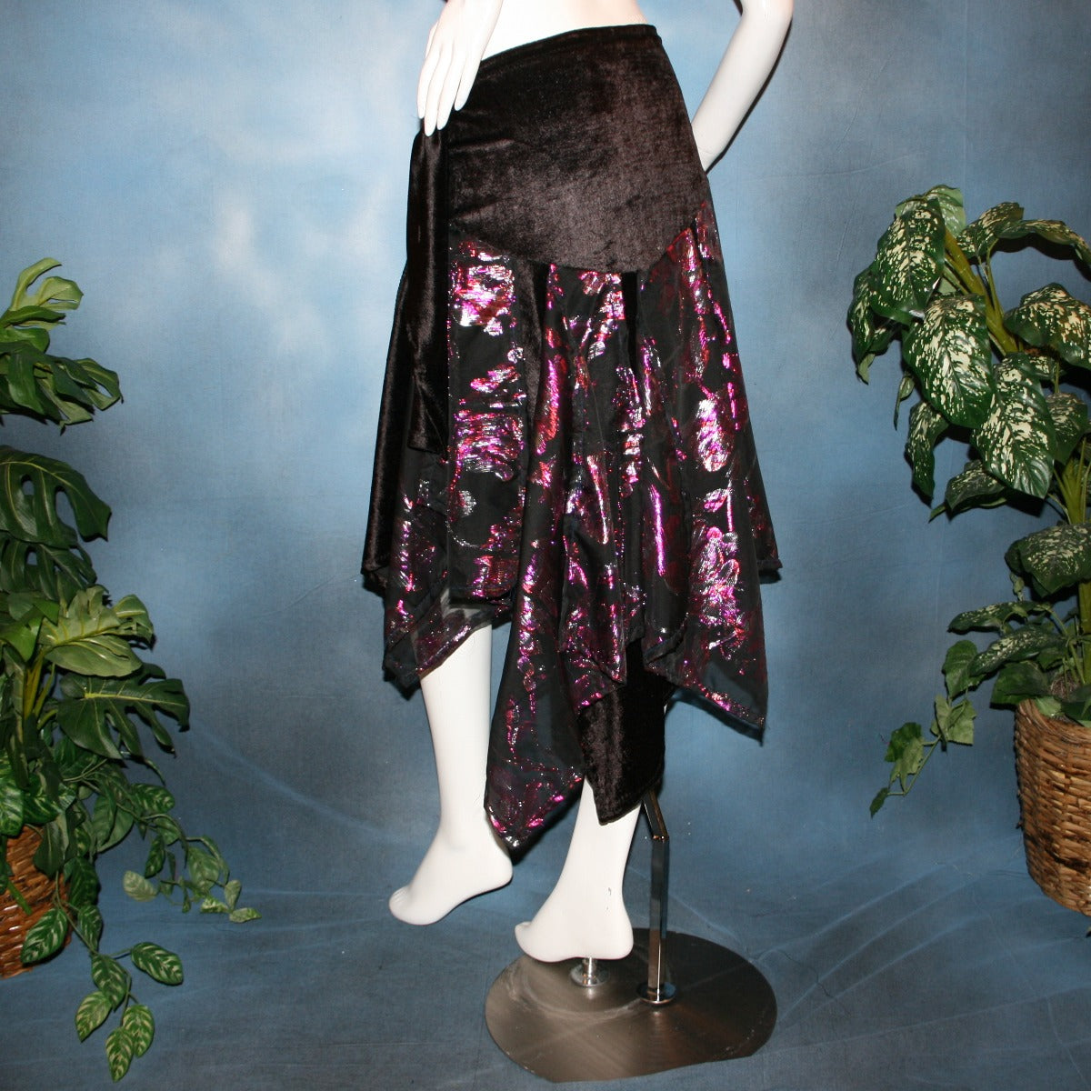 back view of Black Latin/rhythm skirt, wrap style,with scarf cut panels was created with yards of a black & fuchsia metallic cut & clip chiffon on a panne' velvet base with ruching & sash.
