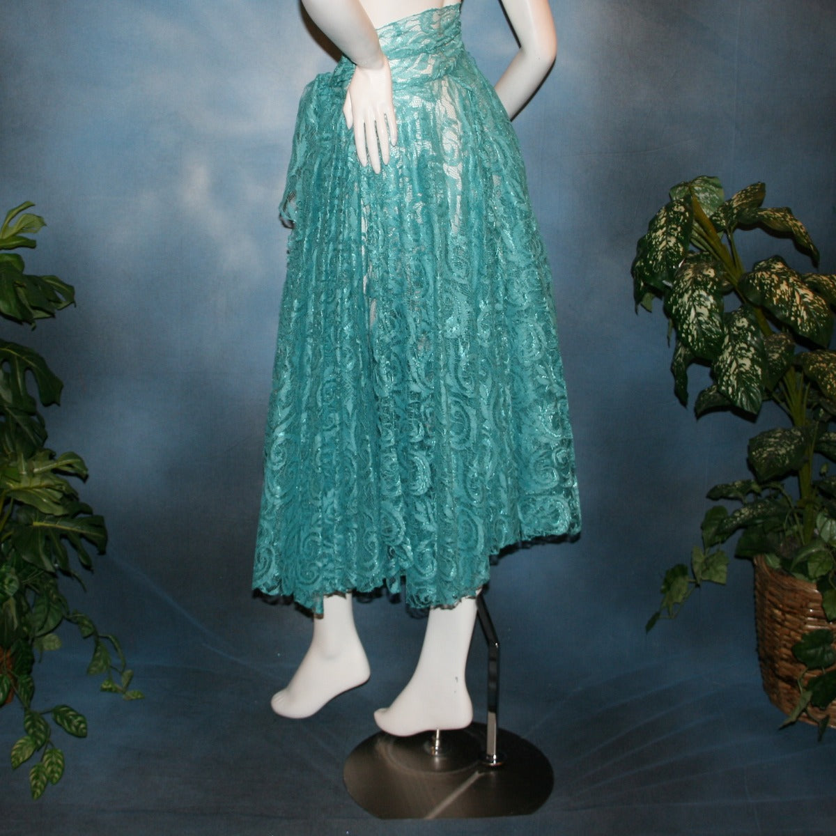 Crystal's Creations back view of Aqua lace ballroom skirt, wrap style, was created with yards of aqua lace, many panels shaped like large petals.