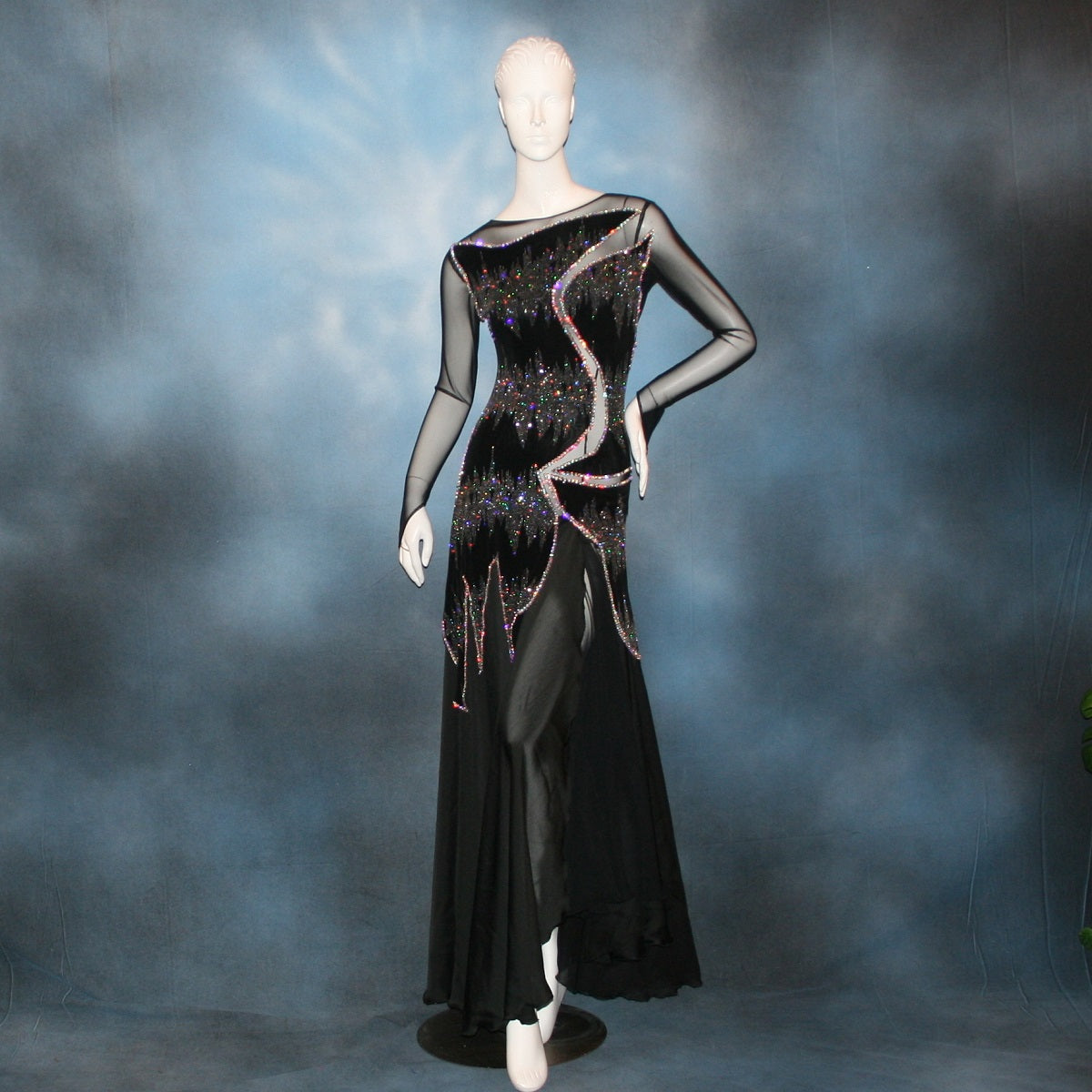 Crystal's Creations Latin/rhythm/converta ballroom dress created in black glitter slinky with an awesome electrifying Crystal AB glitter pattern artistically placed on a black stretch mesh base, embellished with Swarovski Crystal AB rhinestone work. It includes 3 skirts so you have 4 different looks for versatility.