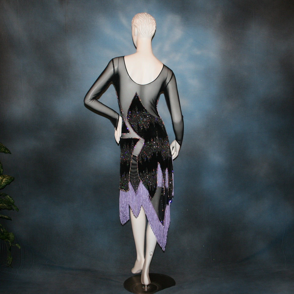 Crystal's Creations back view of lavender underskirt with Latin/rhythm/converta ballroom dress created in black glitter slinky with an awesome electrifying Crystal AB glitter pattern artistically placed on a black stretch mesh base, embellished with Swarovski Crystal AB rhinestone work. It includes 3 skirts so you have 4 different looks for versatility.