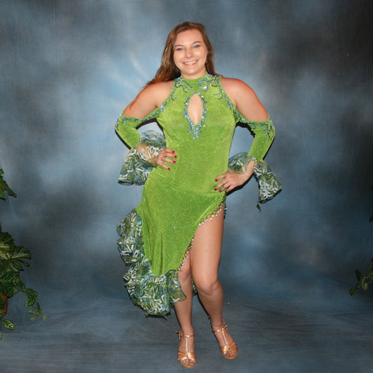 Crystal's Creations Green Latin/rhythm dance dress was created in apple green glitterknit slinky & printed chiffon flounces, embellished with sapphire & light sapphire Swarovski rhinestones, with hand beading.