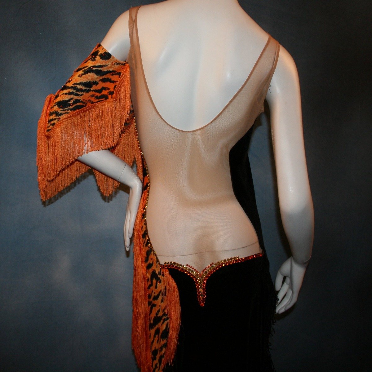 Crystal's Creations back close up view of orange & black tiger print Latin/rhythm dress with fringe
