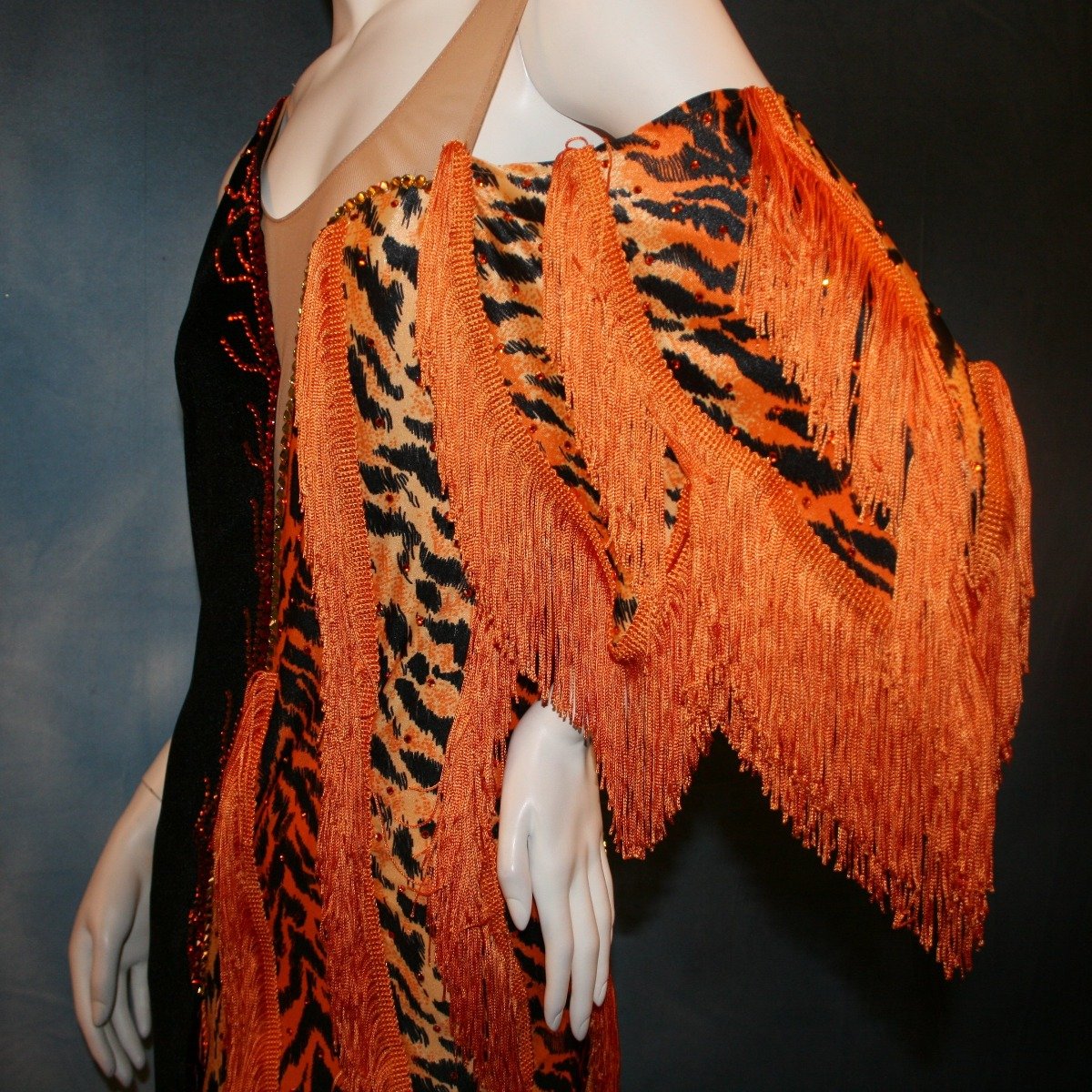Crystal's Creations top close up view of orange & black tiger print Latin/rhythm dress with fringe