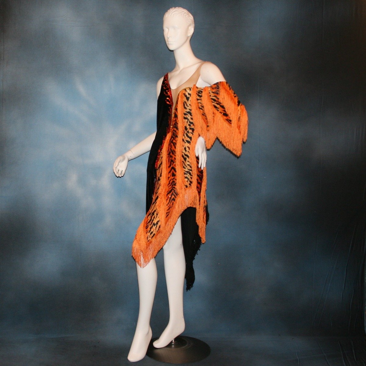 Crystal's Creations side view of orange & black tiger print Latin/rhythm dress with fringe