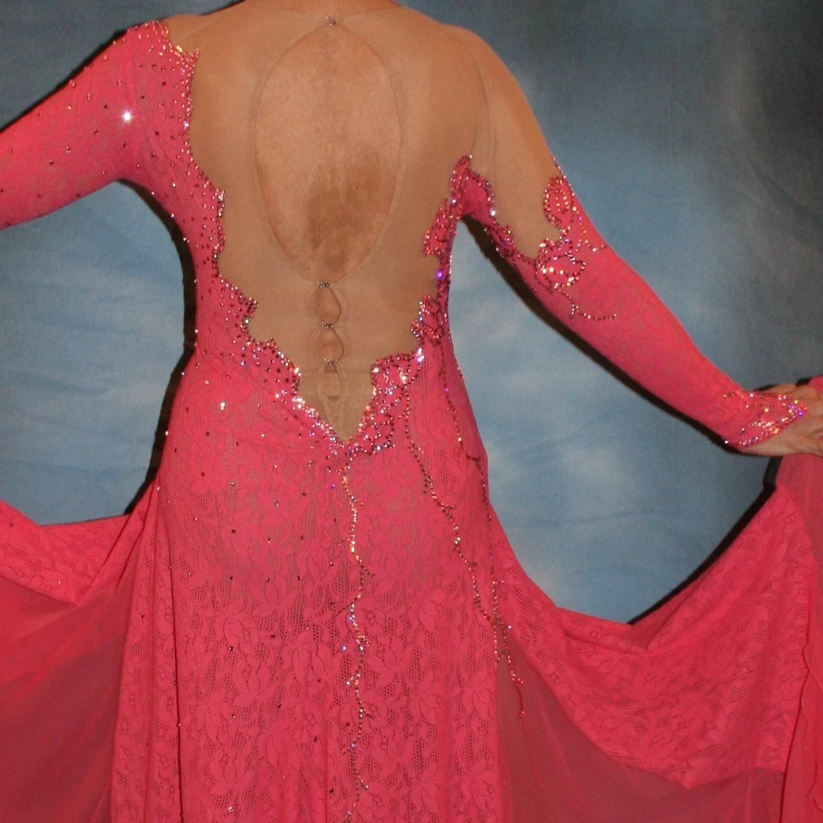 Crystal's Creations back close up view of Gorgeous salmon pink ballroom dance dress was created from salmon pink stretch lace on nude illusion base with yards & yards of salmon pink chiffon insets & flounces …