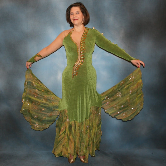 Crystal's Creations Green ballroom dress created of luxurious olive green solid slinky on nude illusion base with glitter chiffon print flounces of olive greens & gold… embellished with olivine, jonquil & peach Swarovski rhinestones.