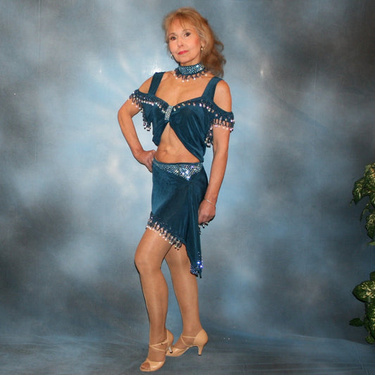 Crystal's Creations 2 piece blue Latin/rhythm dance dress was created of deep sea blue luxurious solid slinky with cascades of hand beaded fringe plus light sapphire Swarovski rhinestone work. The Latin dance skirt has built in tights.