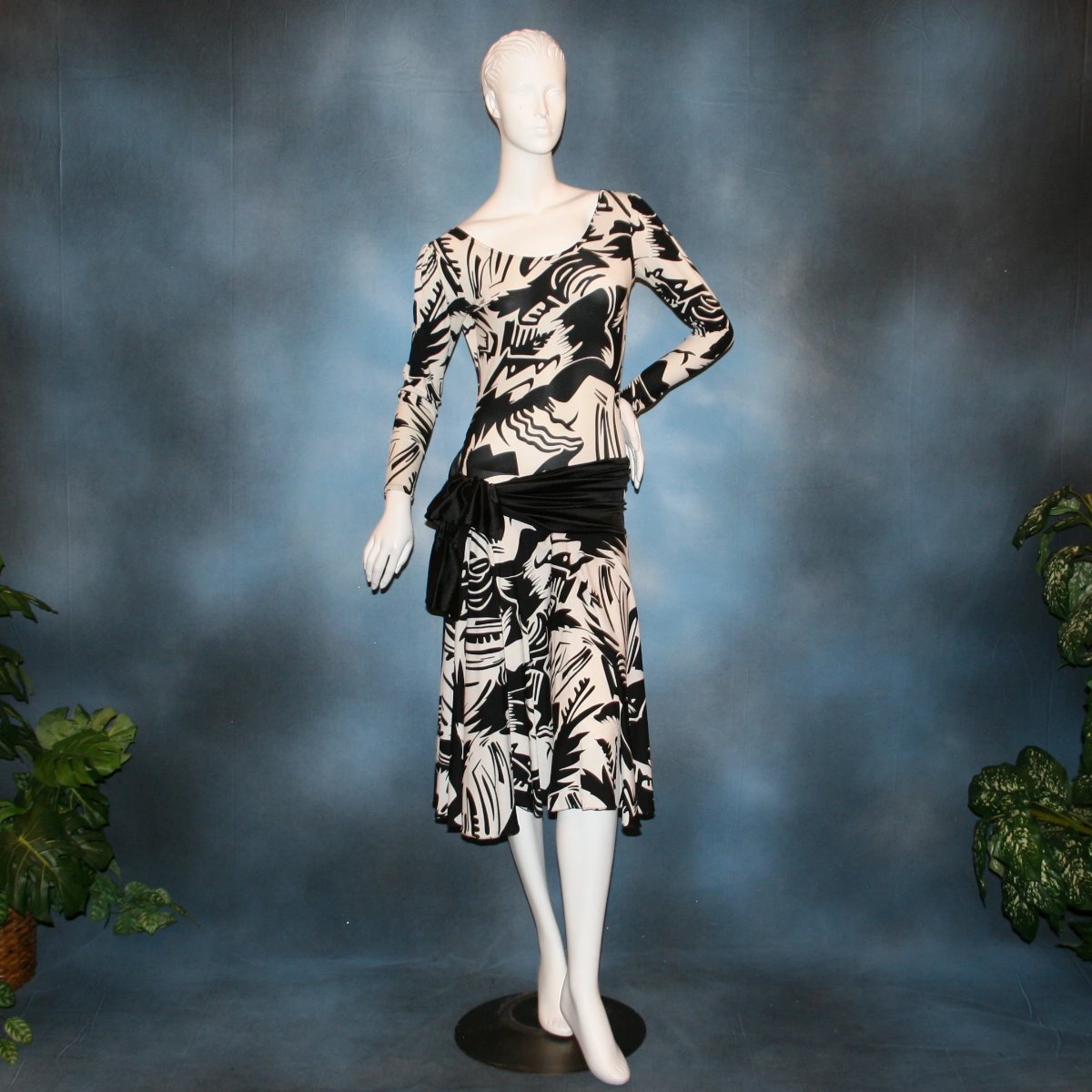 Black & white tropical print lycra dress with solid black hip sash. Bodysuit base, so a great dress for Latin/rhythm dance practice or ballroom teachers!